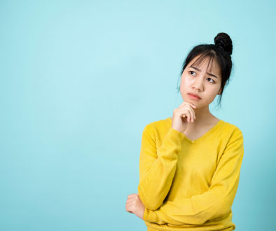 Woman thinking with her hand on her chin