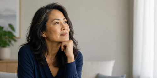Asian woman hand on chin thinking